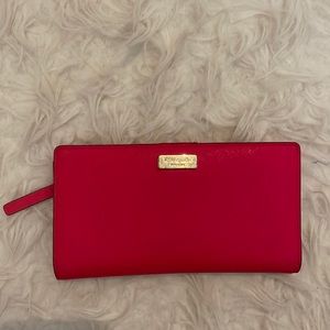 Hot pink wallet Kate Spade few marks  on the metal